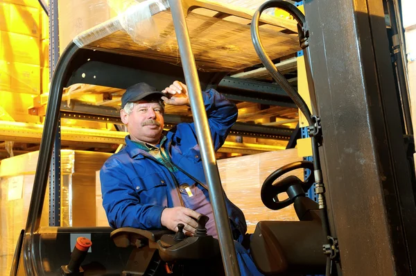 Forklift loader worker at warehouse — Stock Photo, Image