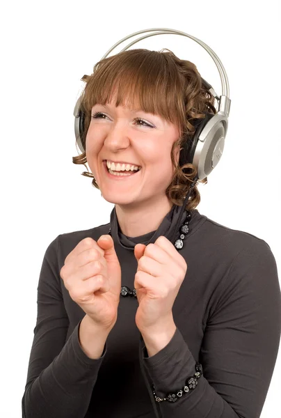 Menina sorridente alegre com fones de ouvido isolados — Fotografia de Stock