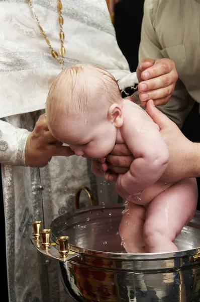 Baby baptism with water in font — Stock Photo, Image