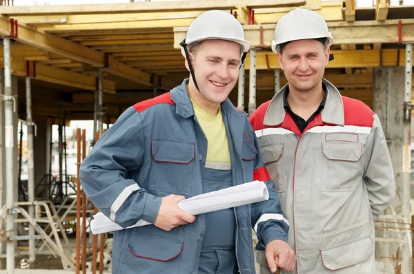 Engineers builders at construction site — Stock Fotó