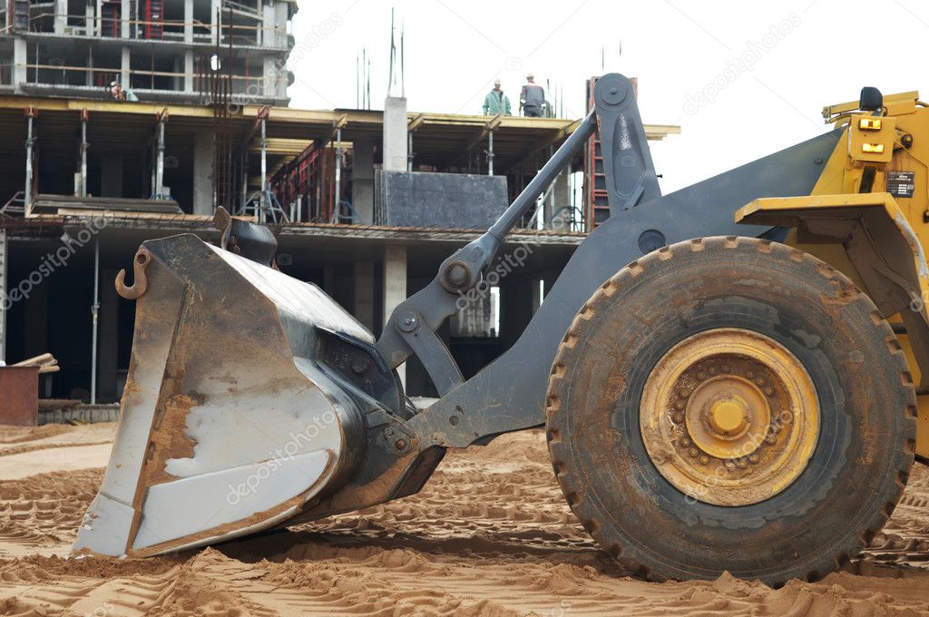 Construction earthmoving works with loader