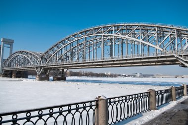 Bridge across the river in winter clipart