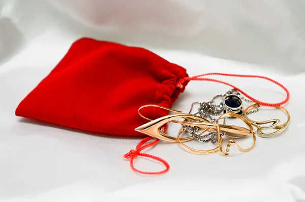 stock image Red small packet with jewelery