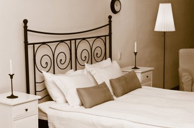 Forged headboard of bed with pillows clipart