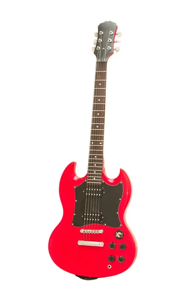 Червона гітара на білому тлі — стокове фото