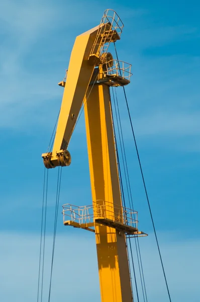 Yellow boom of harbour crane — Stock Photo, Image