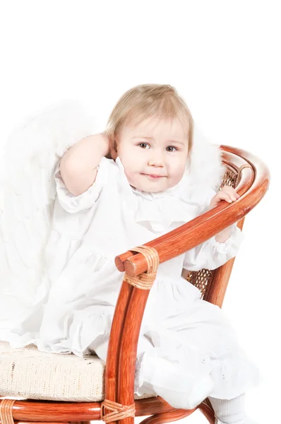 Criança sentada na cadeira . — Fotografia de Stock