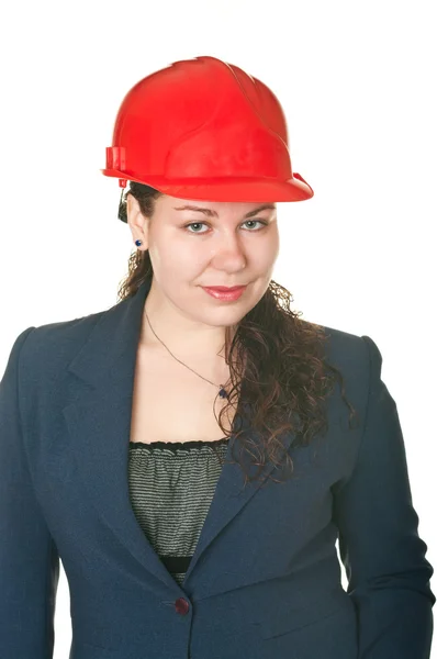 A bela arquiteta mulher no capacete vermelho — Fotografia de Stock