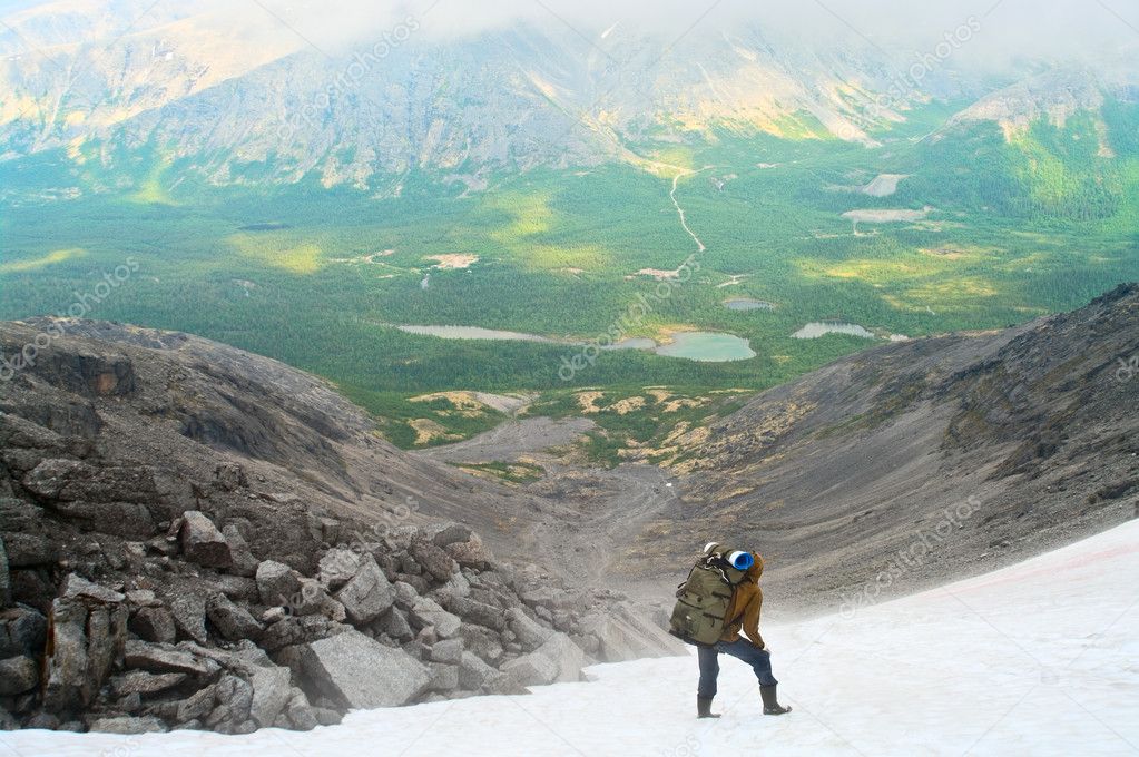 Man standing on peak of mountains