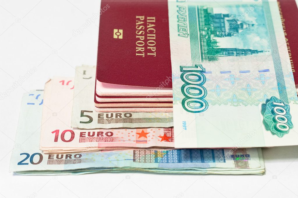 Pile of passports, euro cash banknotes and Russian banknote by thousand rub