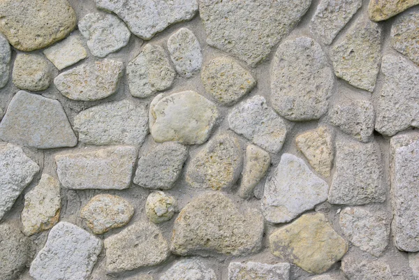 Textura da parede revestida de pedra do mar — Fotografia de Stock