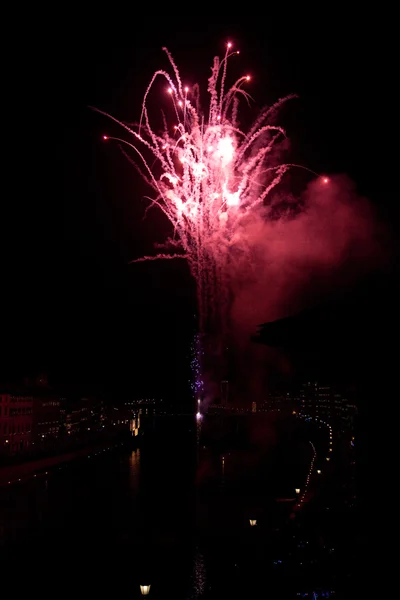 Fireworks and their reflection into the river — Stock Photo, Image