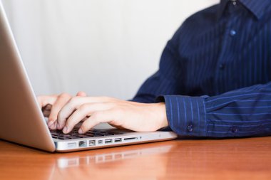 Businessman Typing on Computer Keyboard clipart