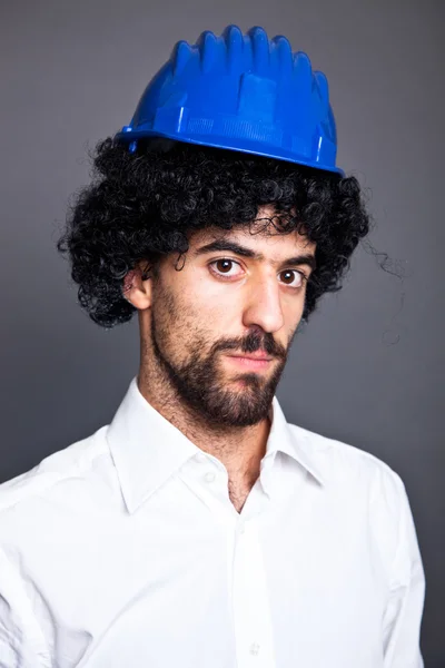 Young Man with Wig and Protective Helmet — Stock Photo, Image