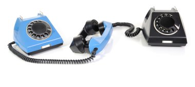 Two telephone with the taken off handset clipart