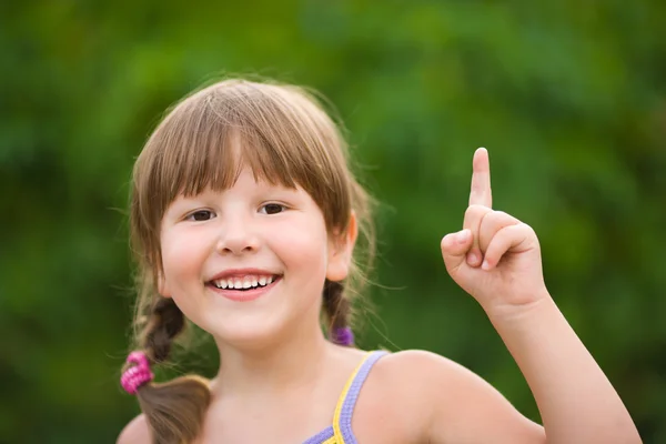 Girl pointing up — Stock Photo, Image