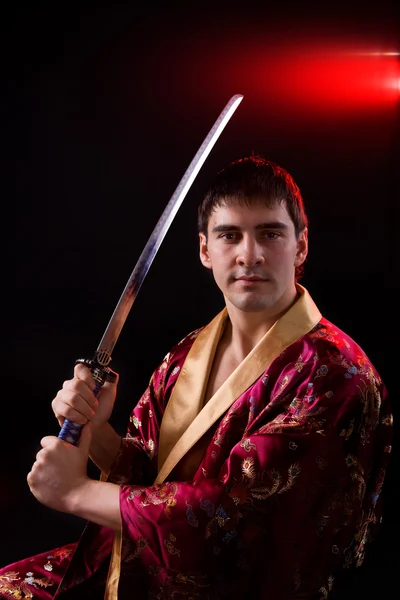 stock image Man holding samurai sword