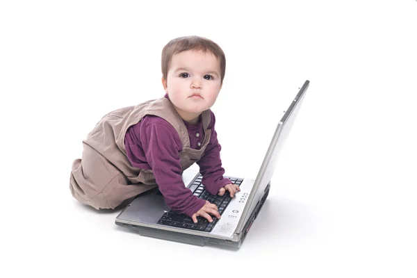 Baby girl with a laptop — Stock Photo, Image