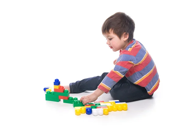 Boy with multicolored bricks — Stock Photo, Image