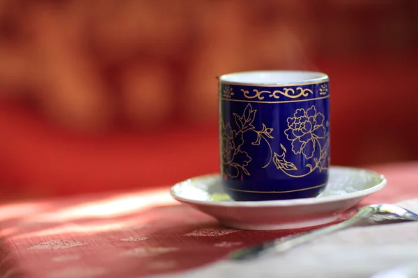 Patterned cup of tea — Stock Photo, Image