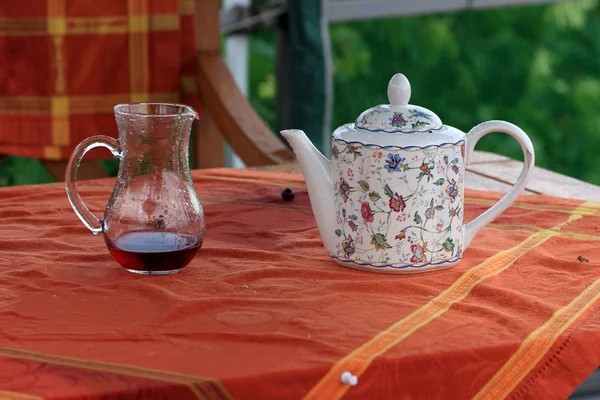 Carafe with juice and teapot — Stock Photo, Image