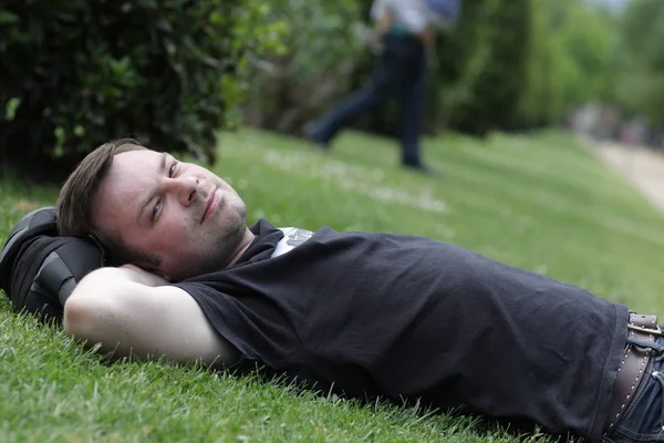 Man is lying on grass — Stock Photo, Image