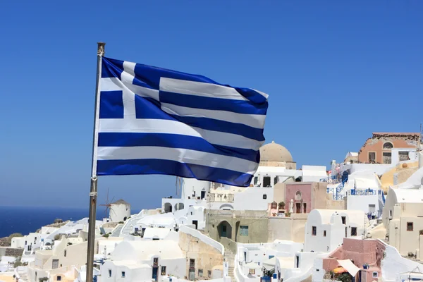 Greece flag on Oia background — Stock Photo, Image