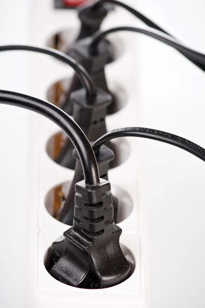 Удлинительный шнур с заглушками — стоковое фото