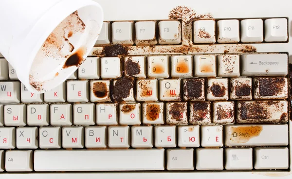 Kaffe spildt på tastaturet - Stock-foto