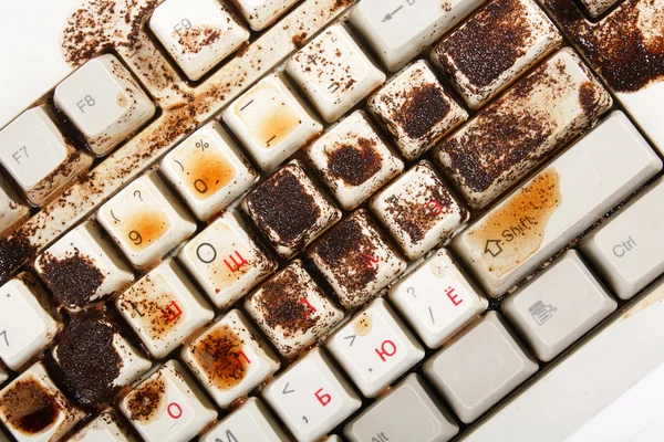 Kaffe spildt på tastaturet - Stock-foto