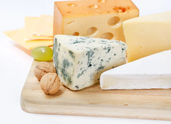Cheese on wood board — Stock Photo, Image
