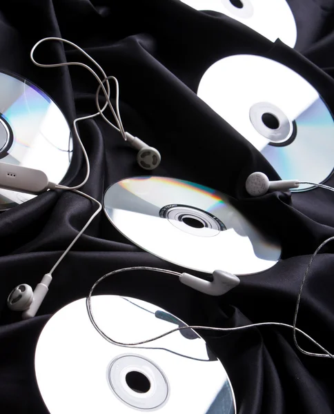 Auriculares sobre disco compacto — Foto de Stock