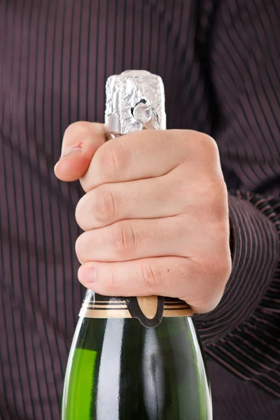 stock image Bottle of champagne in the hand