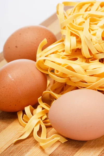 Noodles and eggs on the table — Stock Photo, Image
