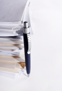 A pen near stack of paper clipart