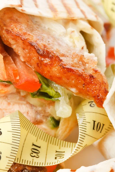 Stock image Tortilla wrap with tape measure