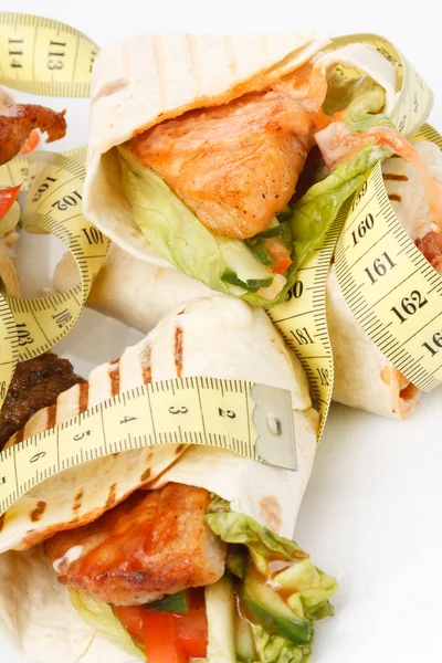 Tortilla wrap with tape measure — Stock Photo, Image