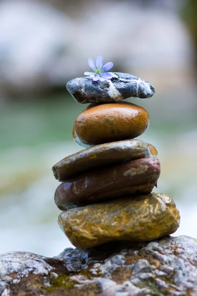 Pebble stones over waterfall — Stock Photo, Image