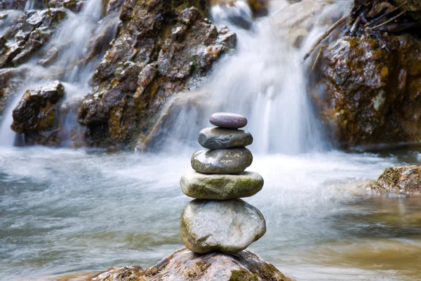 stock image Pebble stones over waterfall