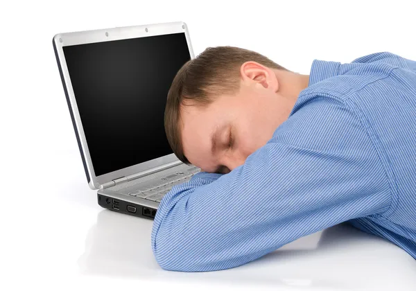 Ο άνθρωπος που κοιμάται σε ένα φορητό υπολογιστή — Φωτογραφία Αρχείου
