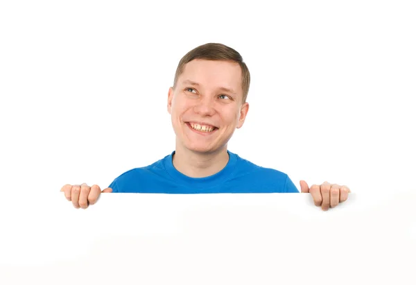 Fiatal férfi keres át egy üres tábla — Stock Fotó