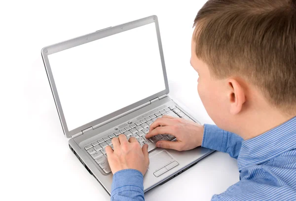 Молодой человек, работающий с ноутбуком Стоковое Фото