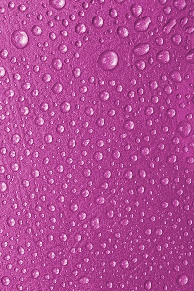 Pink water drops on a glass — Stock Photo, Image