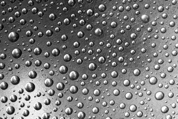 Rain droplets on a grey steel — Stock Photo, Image
