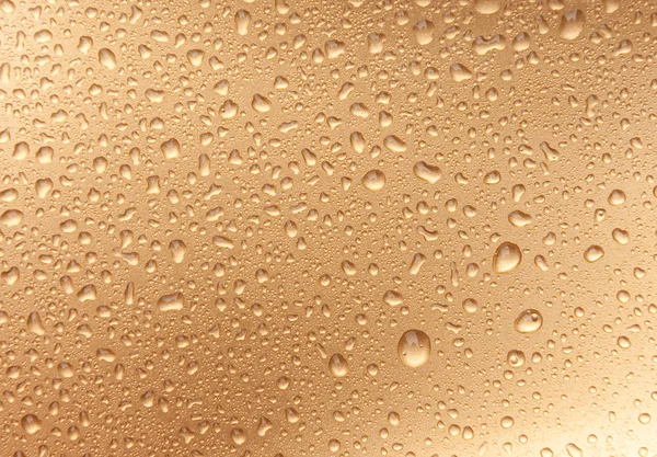Golden waterdrops from above — Stock Photo, Image