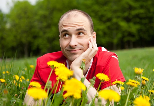 Young man on the grass — Stock Photo, Image