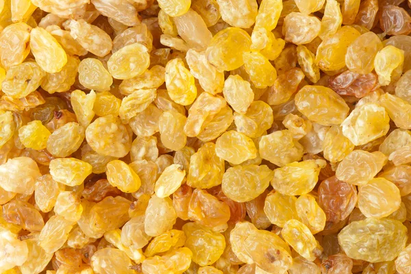 Golden raisins background — Stock Photo, Image