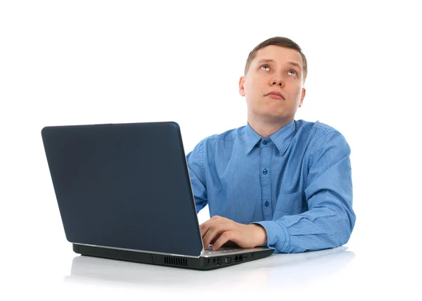 Muž pracující na svém přenosném počítači Stock Snímky
