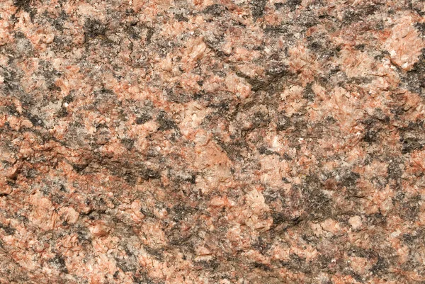 Gros plan d'une texture de granit rouge — Photo