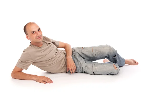 Άνθρωπος που ξάπλωμα σε ένα πάτωμα — Φωτογραφία Αρχείου